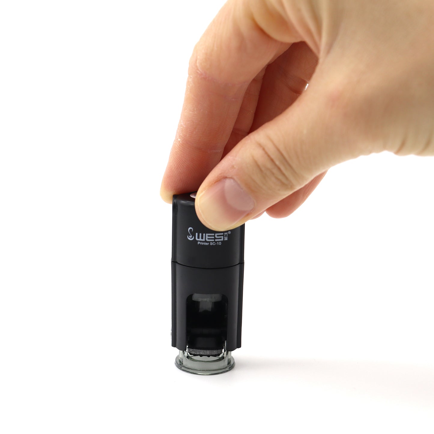 Self Inking Stamp Being Pressed Down By A Hand
