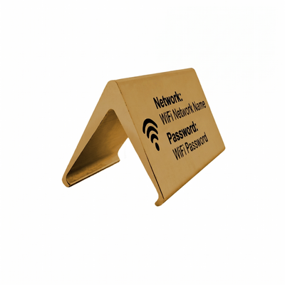 Gold metal sign with text for WiFi network name and password on a white background