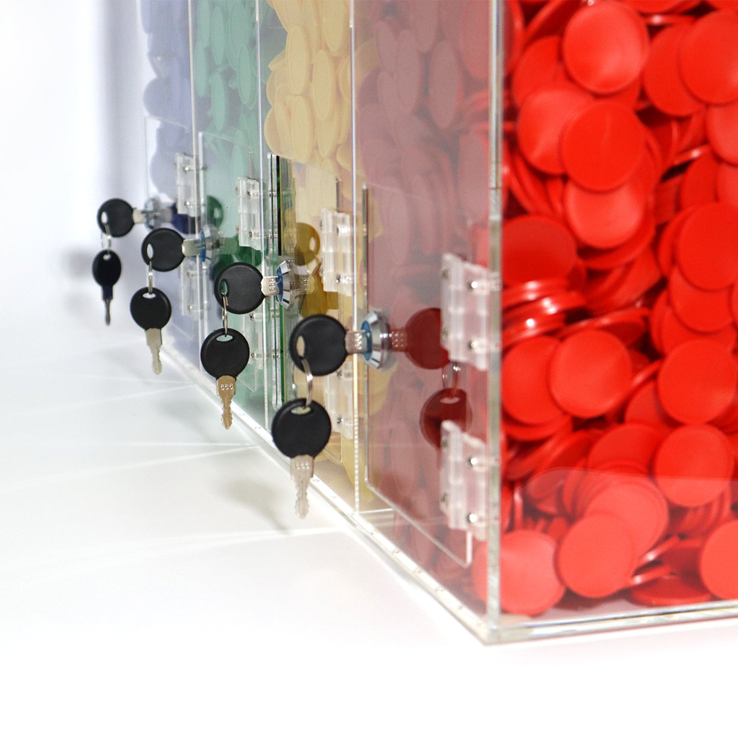 House Shaped Token Collector With Four Houses Filled with Red, Yellow, Green and Blue Tokens Rear View Of The Doors at The Bottom For Emptying the collector