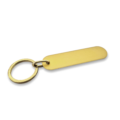 Long Oval Aluminium Key Tag Gold With Matching Split Key Ring Model Vicky 78x20mm Flatlay Side View
