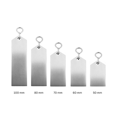 Set of five silver aluminium metal tags with varying sizes on a white background