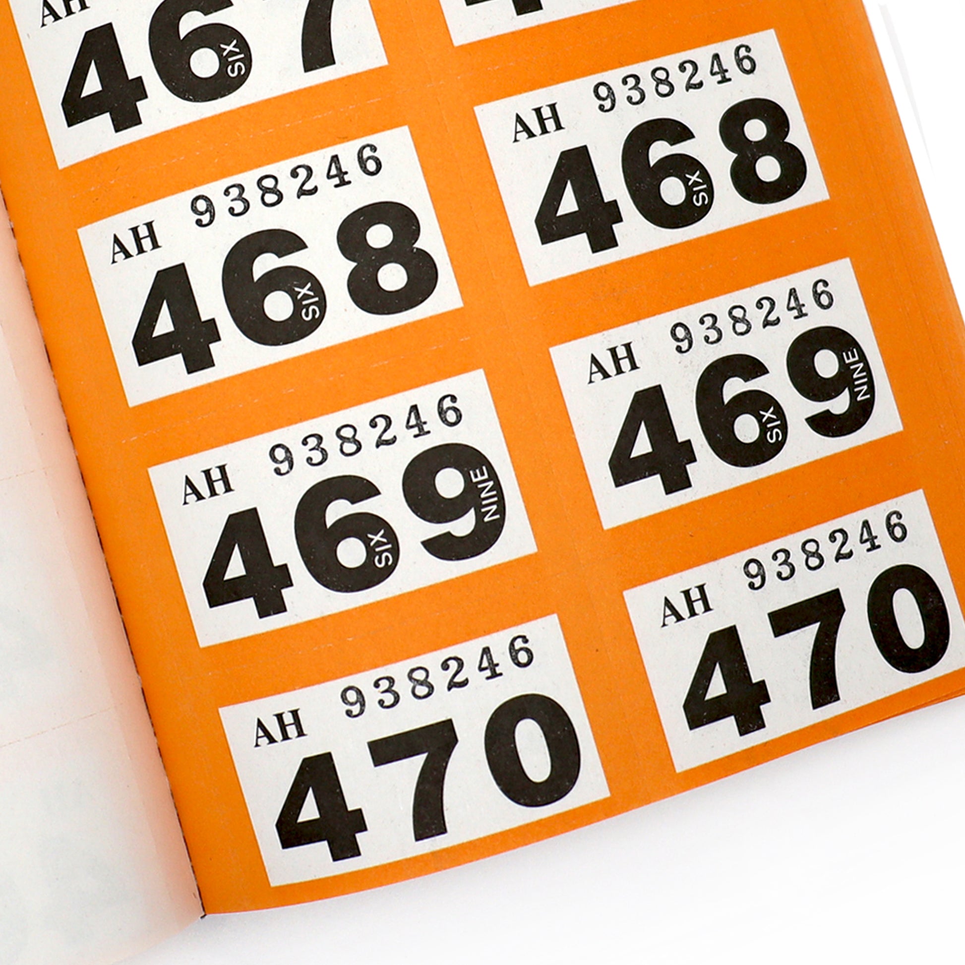 Orange Double Raffle Numbers Ticket Book Close Up of Ticket